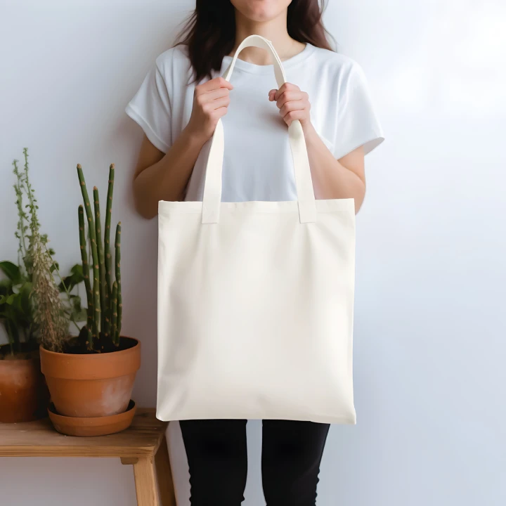 Woman Holding White Tote Bag Mockup Front View Template