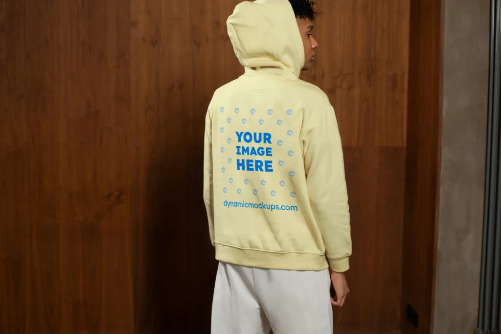 Man Wearing Cream Hoodie Mockup Back View Template