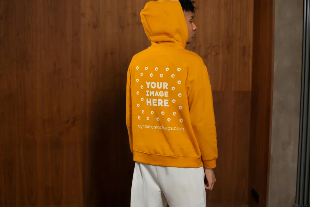 Man Wearing Orange Hoodie Mockup Back View Template