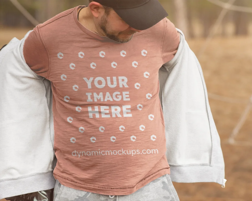 Man Wearing Peach Sweatshirt Mockup Front View Template