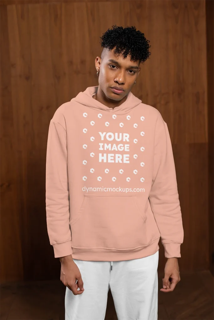 Man Wearing Peach Hoodie Mockup Front View Template