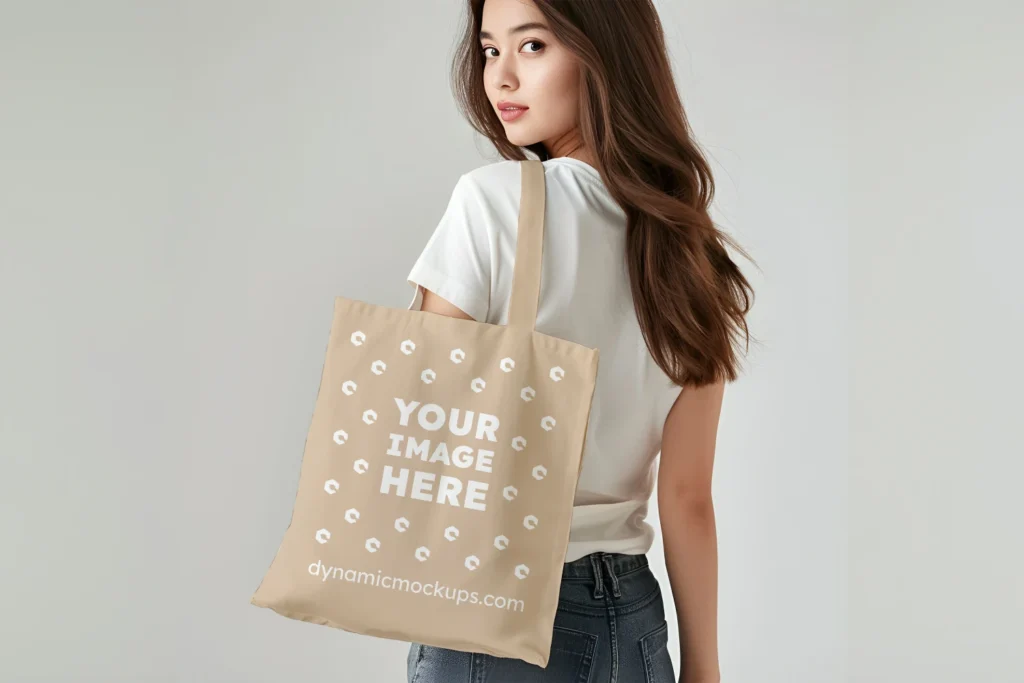 Woman Holding Beige Tote Bag Mockup Back View Template