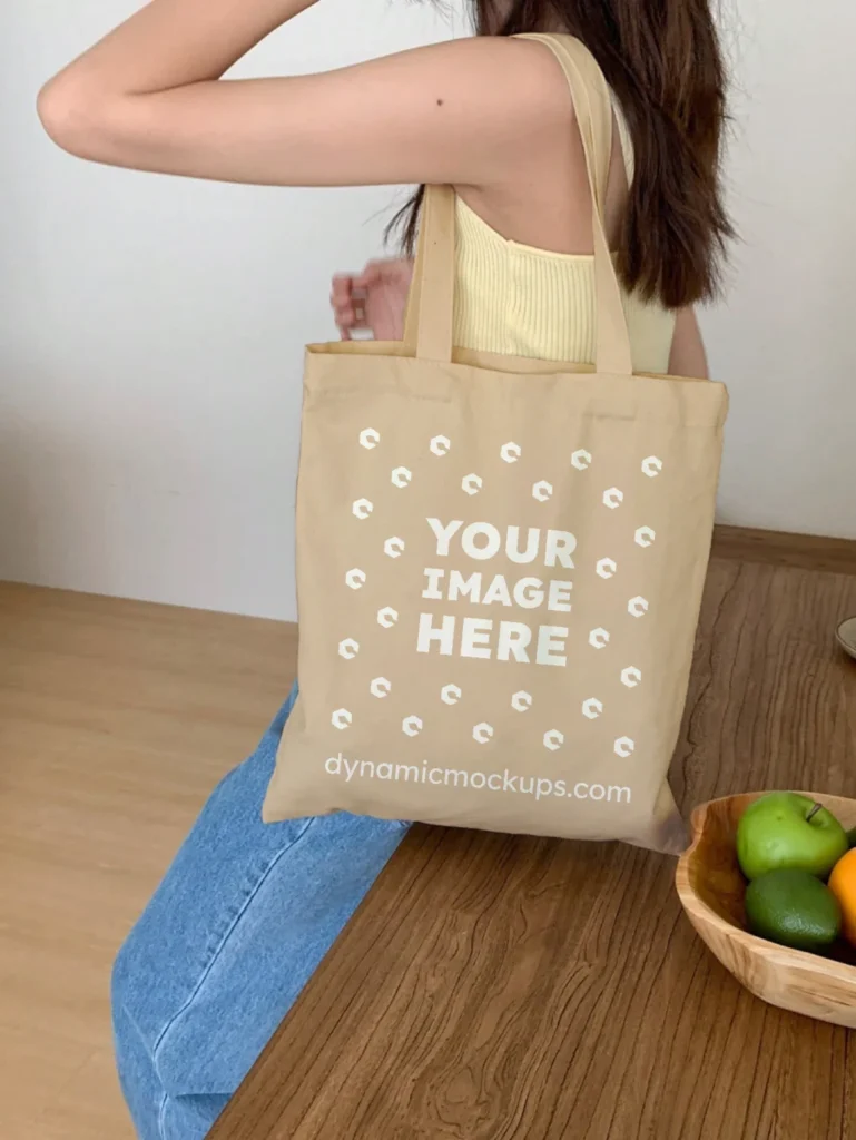 Woman Holding Beige Tote Bag Mockup Side View Template