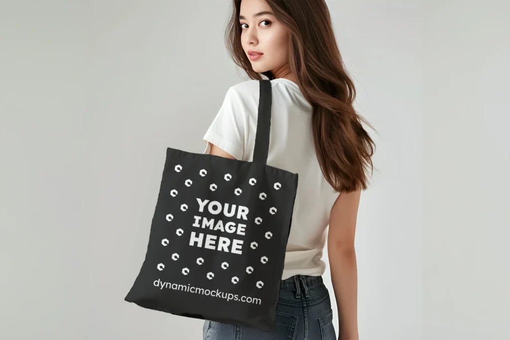 Woman Holding Black Tote Bag Mockup Back View Template