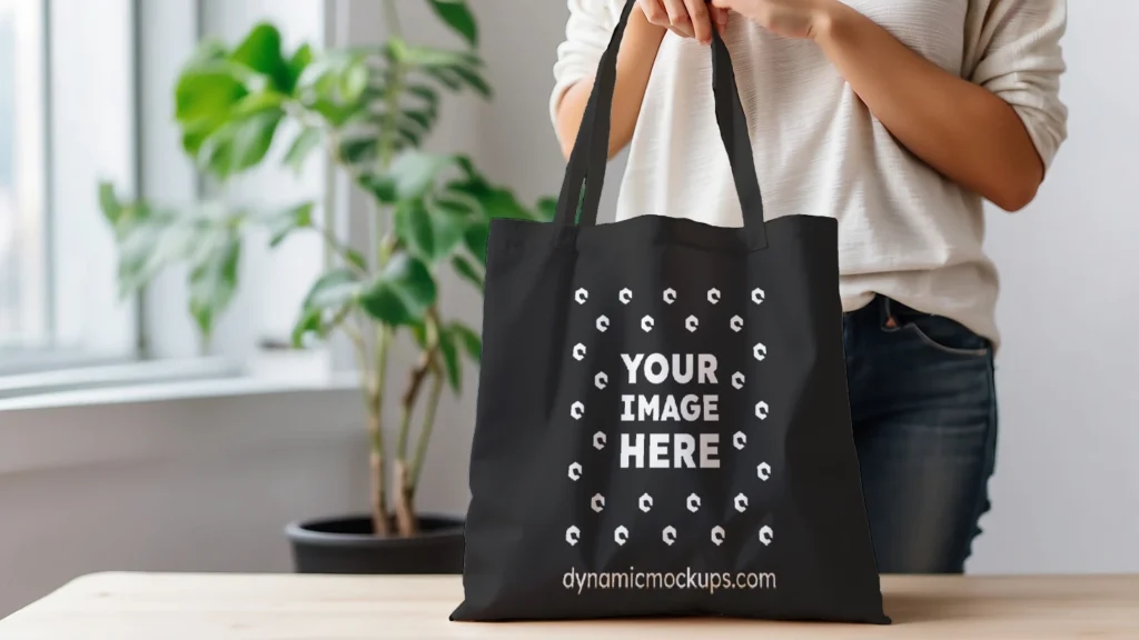 Woman Holding Black Tote Bag Mockup Front View Template