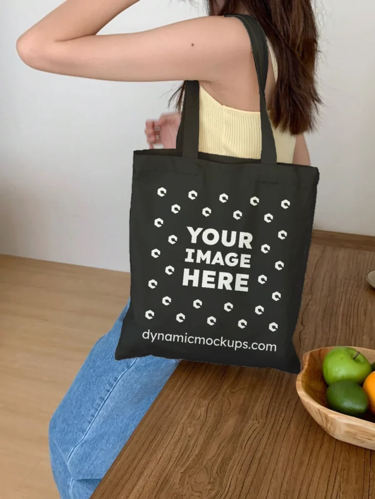 Woman Holding Black Tote Bag Mockup Side View Template