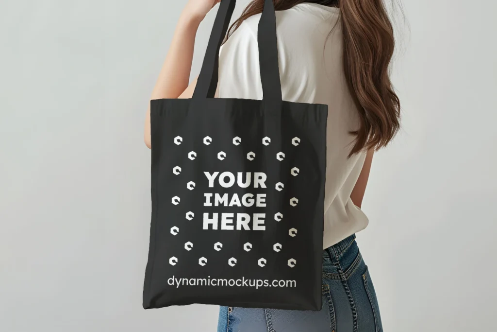 Woman Holding Black Tote Bag Mockup Side View Template