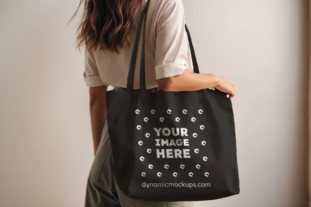 Woman Holding Black Tote Bag Mockup Side View Template