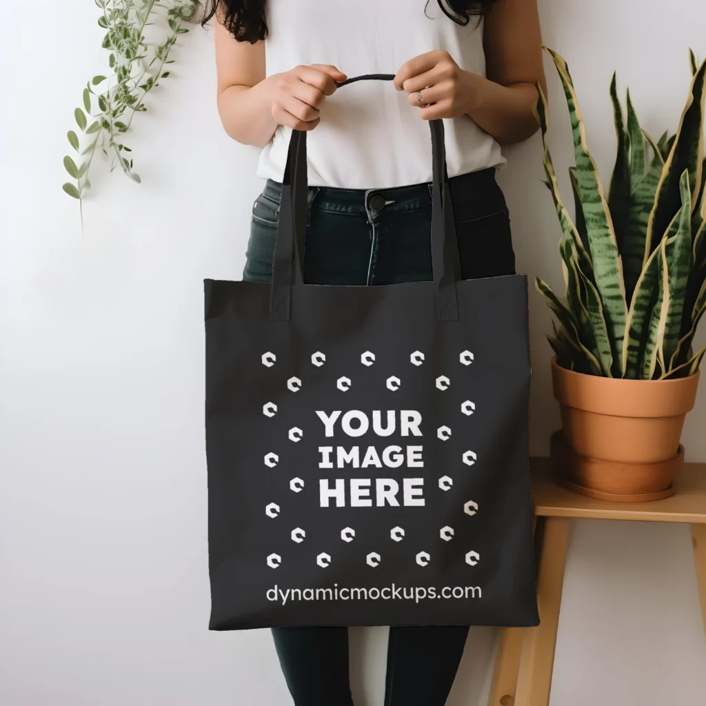 Woman Holding Black Tote Bag Mockup Front View Template