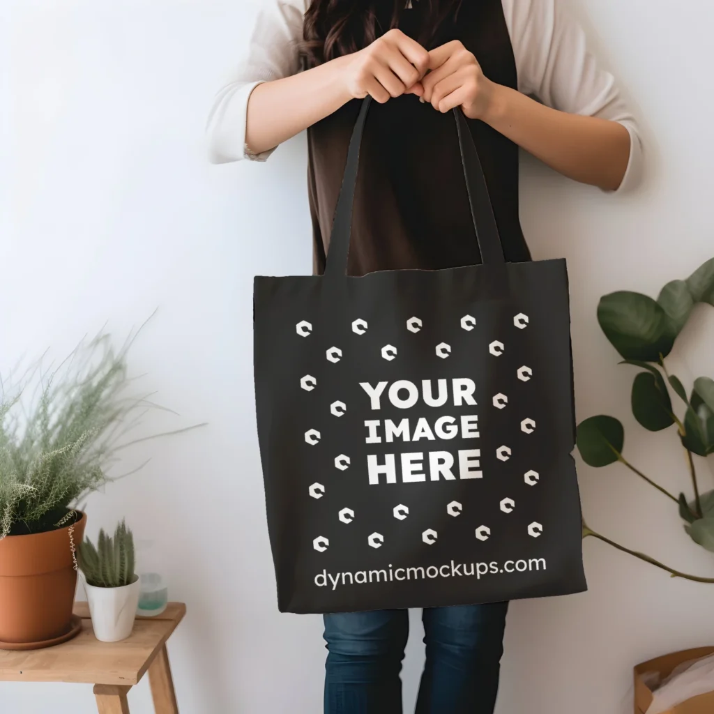 Woman Holding Black Tote Bag Mockup Front View Template