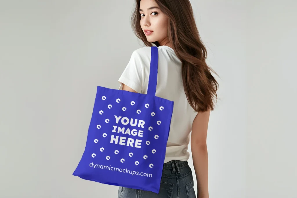 Woman Holding Blue Tote Bag Mockup Back View Template