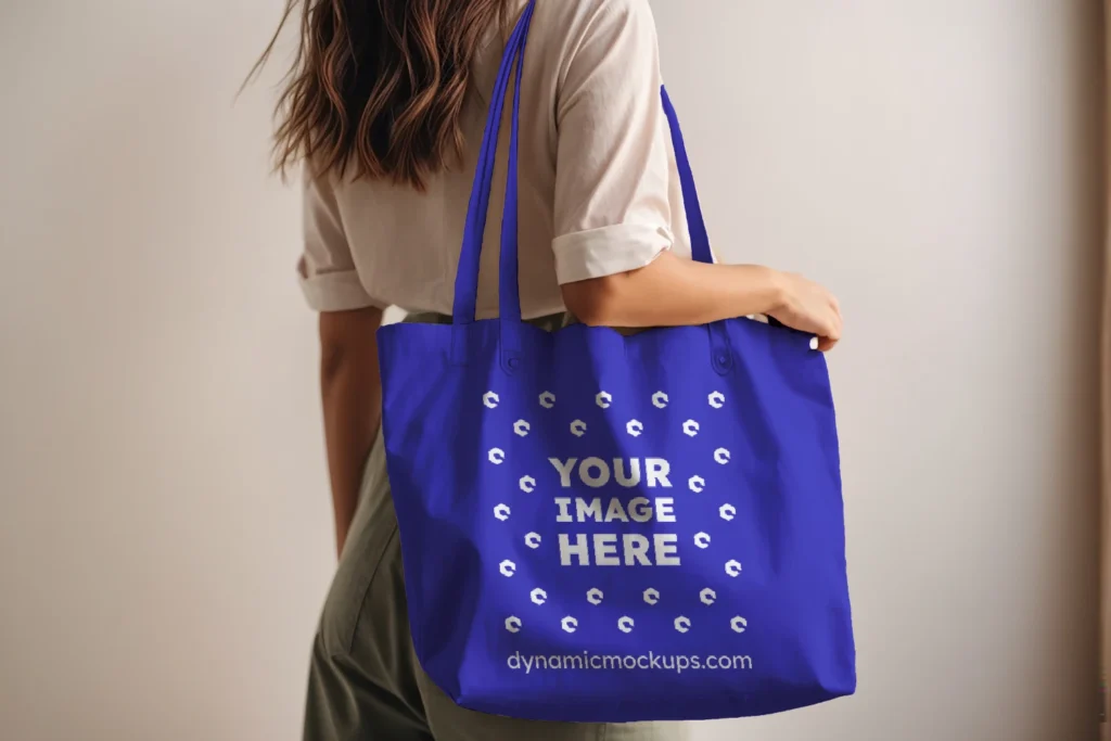 Woman Holding Blue Tote Bag Mockup Side View Template