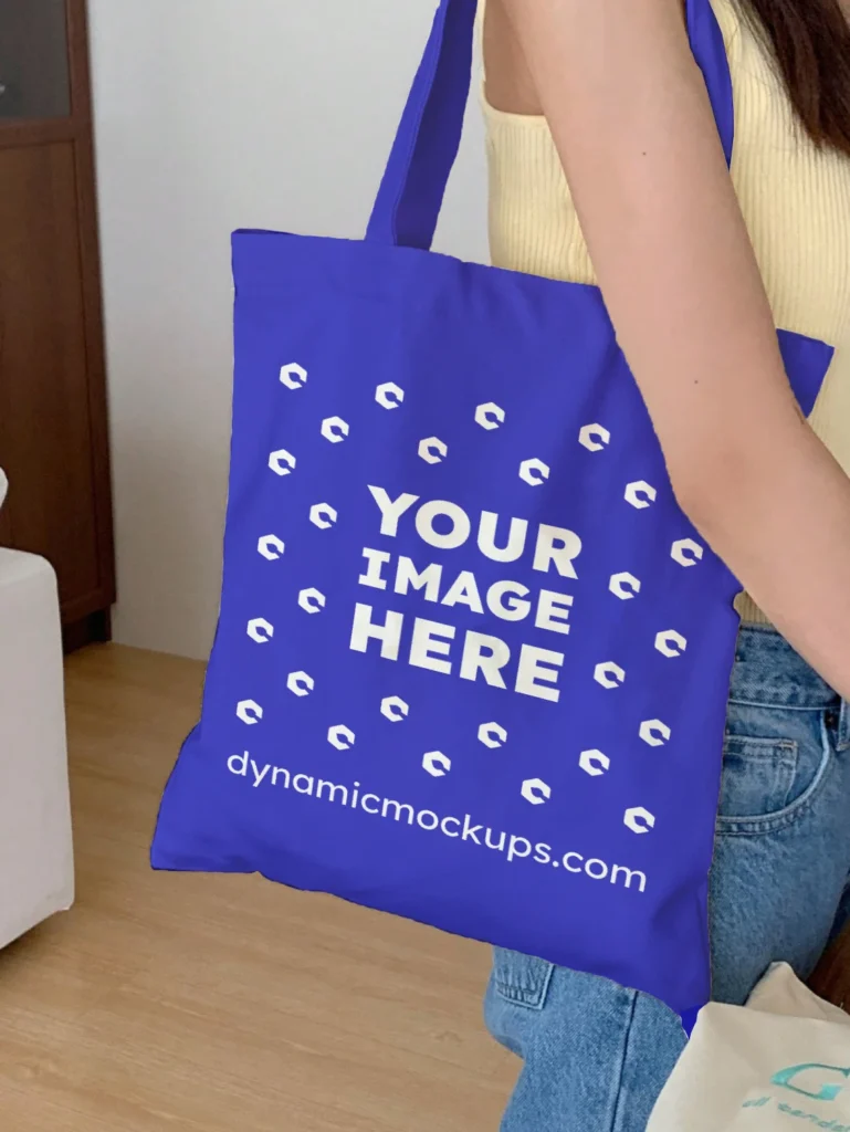 Woman Holding Blue Tote Bag Mockup Side View Template