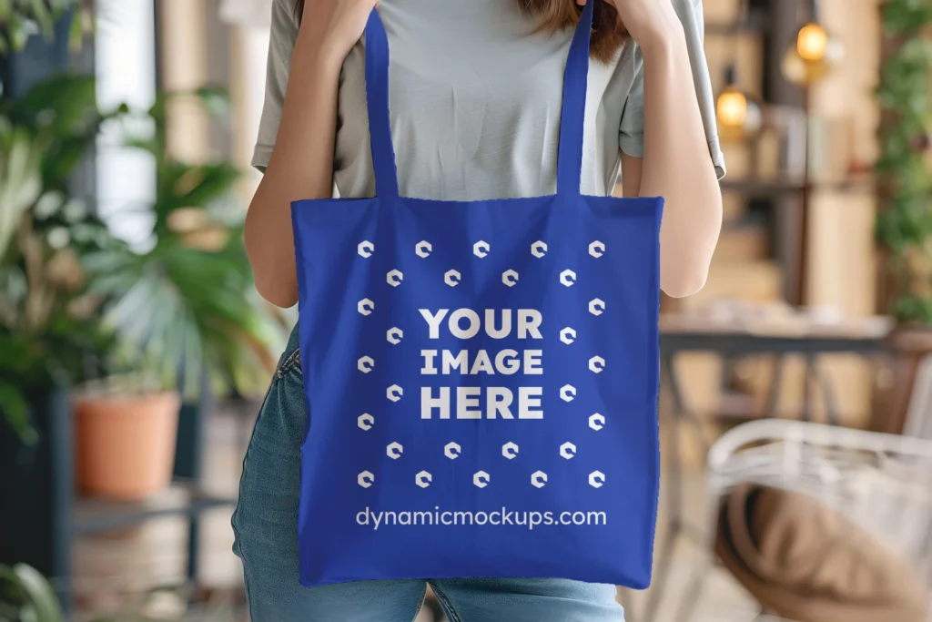 Woman Holding Dark Blue Tote Bag Mockup Front View Template