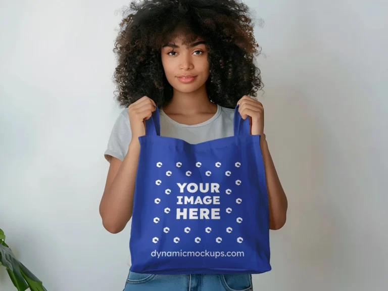 Woman Holding Dark Blue Tote Bag Mockup Front View Template