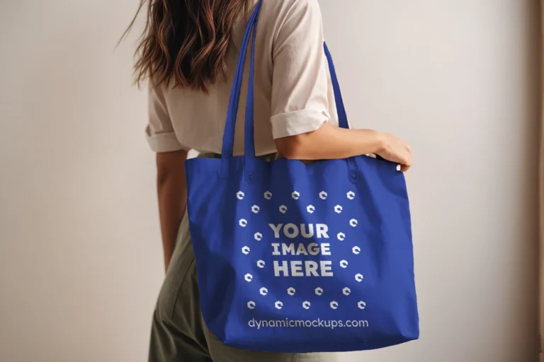 Woman Holding Dark Blue Tote Bag Mockup Side View Template