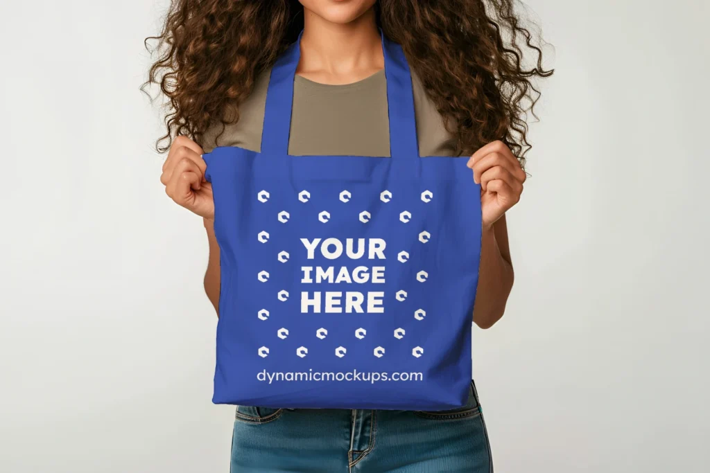 Woman Holding Dark Blue Tote Bag Mockup Front View Template