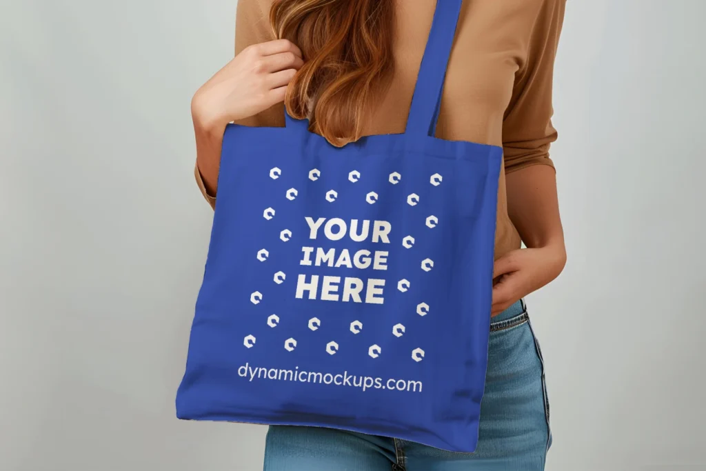 Woman Holding Dark Blue Tote Bag Mockup Front View Template