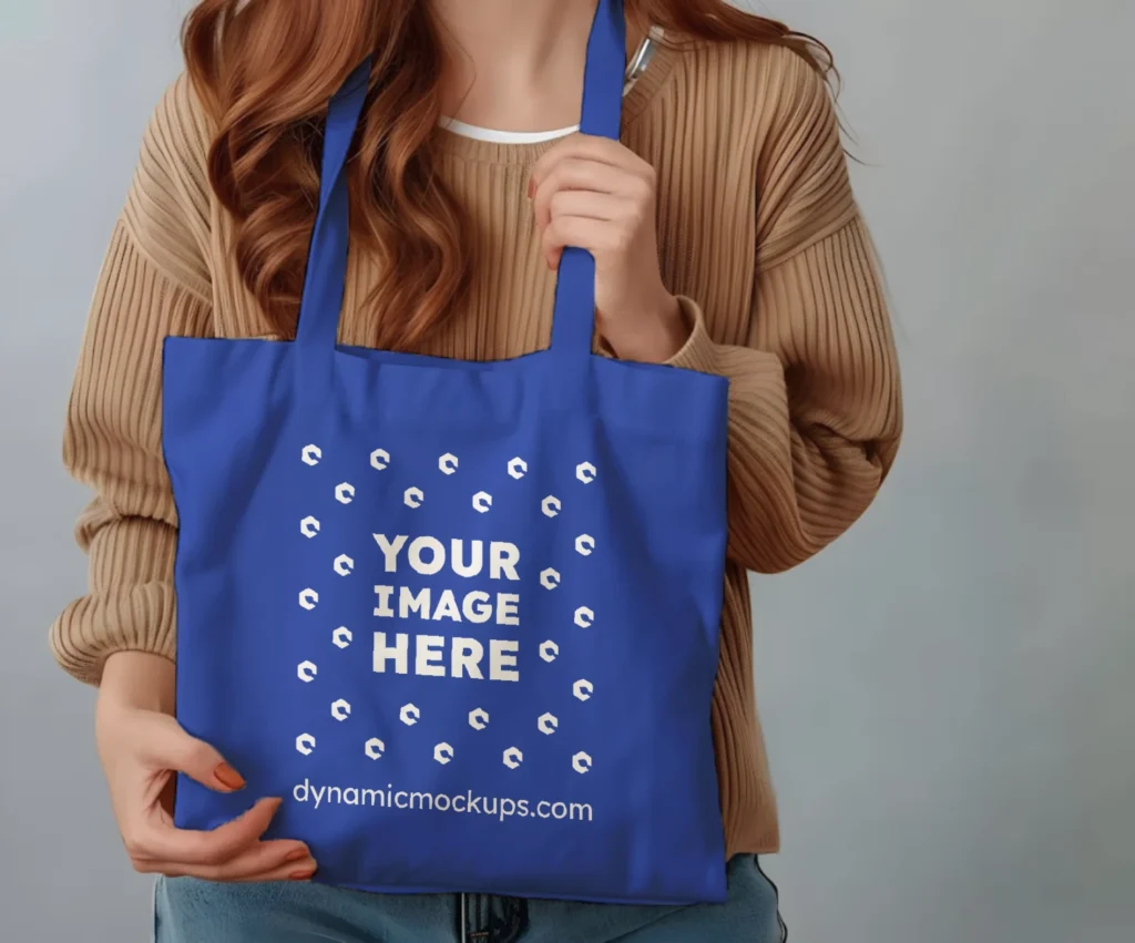 Woman Holding Dark Blue Tote Bag Mockup Front View Template