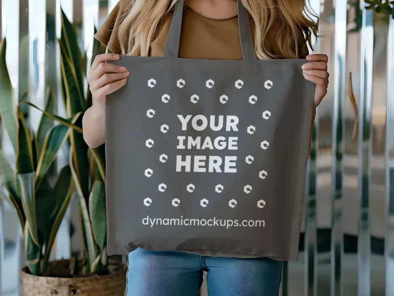 Woman Holding Dark Gray Tote Bag Mockup Front View Template