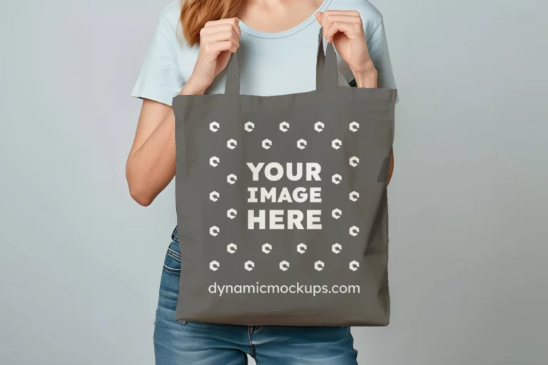 Woman Holding Dark Gray Tote Bag Mockup Front View Template