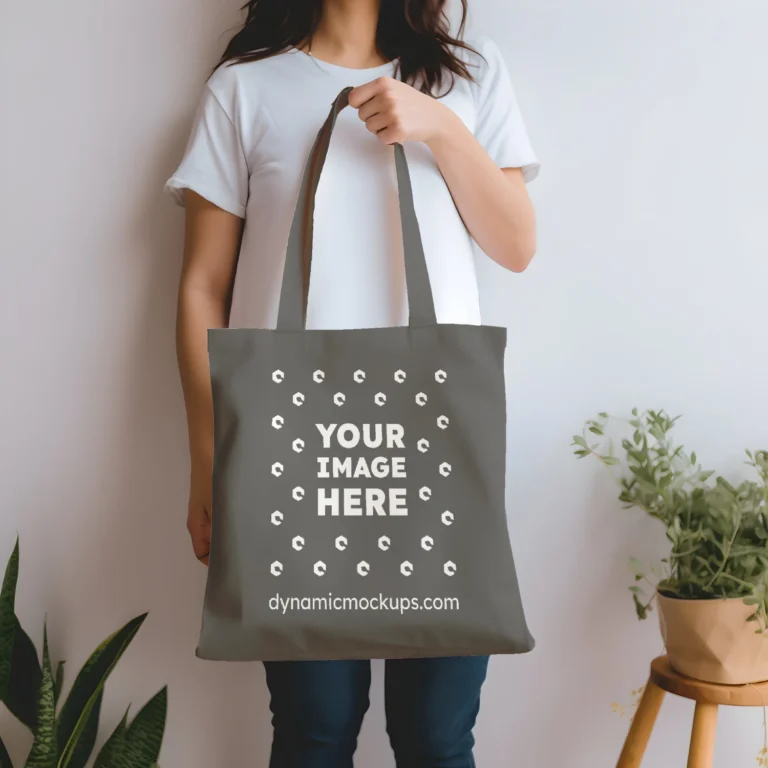 Woman Holding Dark Gray Tote Bag Mockup Front View Template