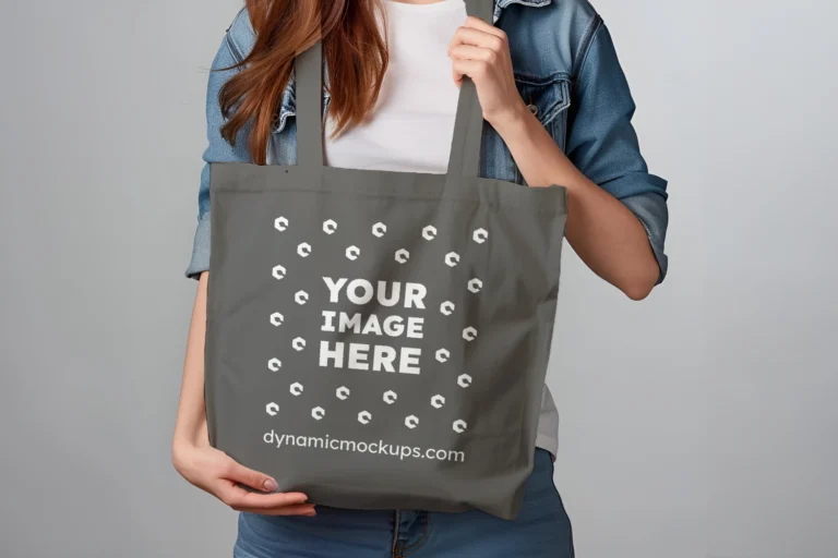 Woman Holding Dark Gray Tote Bag Mockup Front View Template