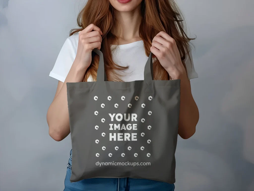 Woman Holding Dark Gray Tote Bag Mockup Front View Template