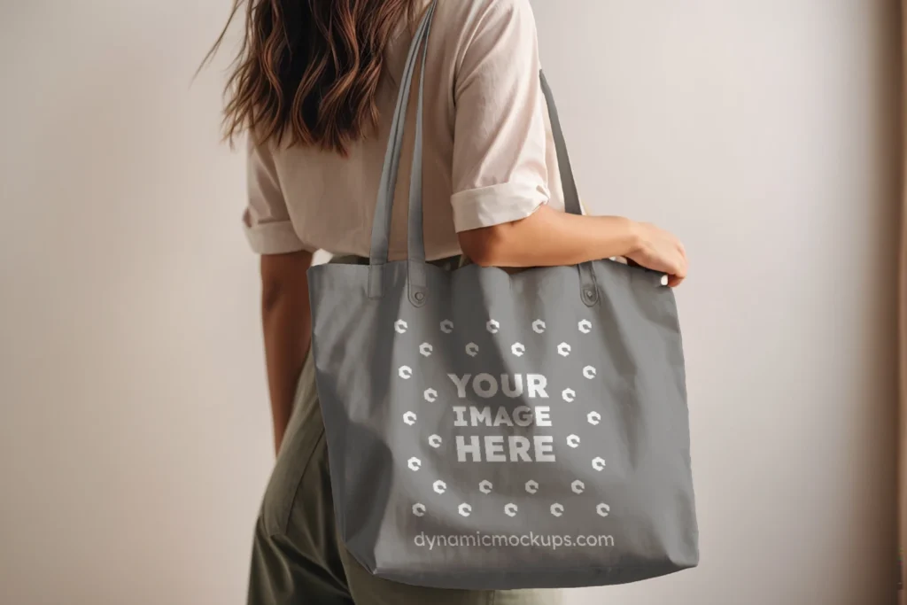 Woman Holding Gray Tote Bag Mockup Side View Template