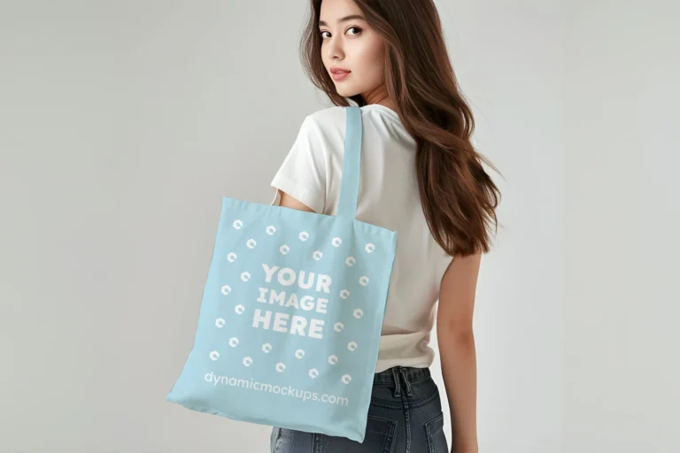 Woman Holding Light Blue Tote Bag Mockup Back View Template