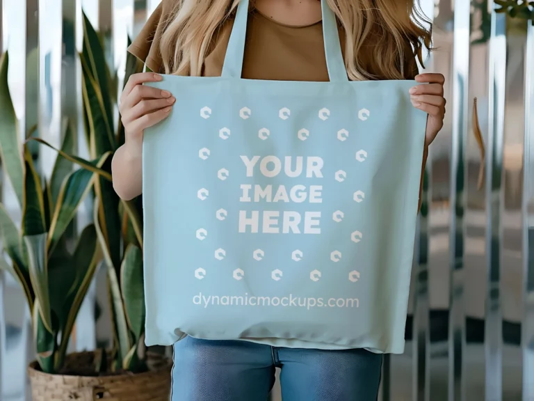 Woman Holding Light Blue Tote Bag Mockup Front View Template