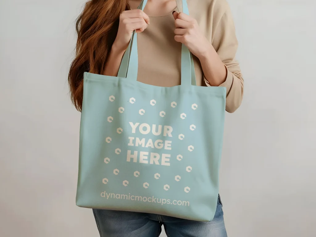 Woman Holding Light Blue Tote Bag Mockup Front View Template