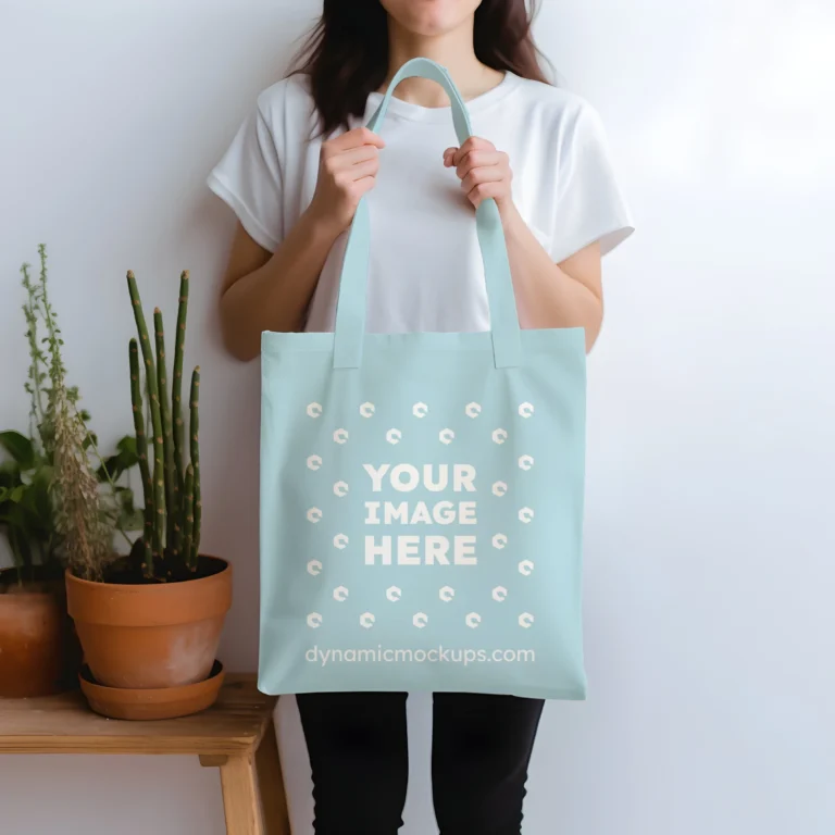 Woman Holding Light Blue Tote Bag Mockup Front View Template