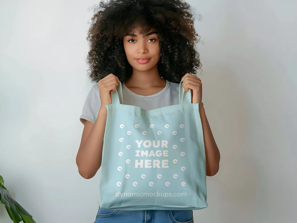 Woman Holding Light Blue Tote Bag Mockup Front View Template