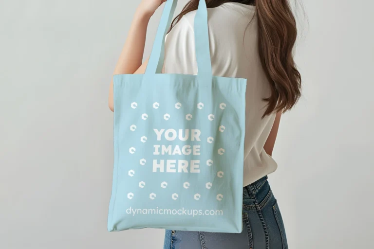 Woman Holding Light Blue Tote Bag Mockup Side View Template