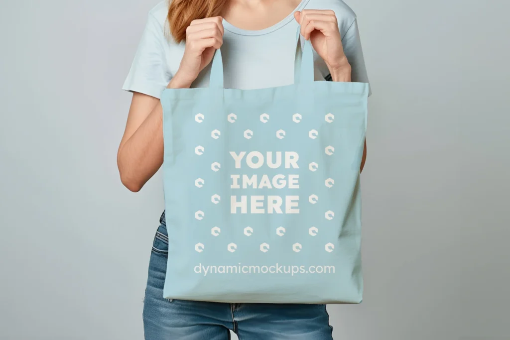 Woman Holding Light Blue Tote Bag Mockup Front View Template