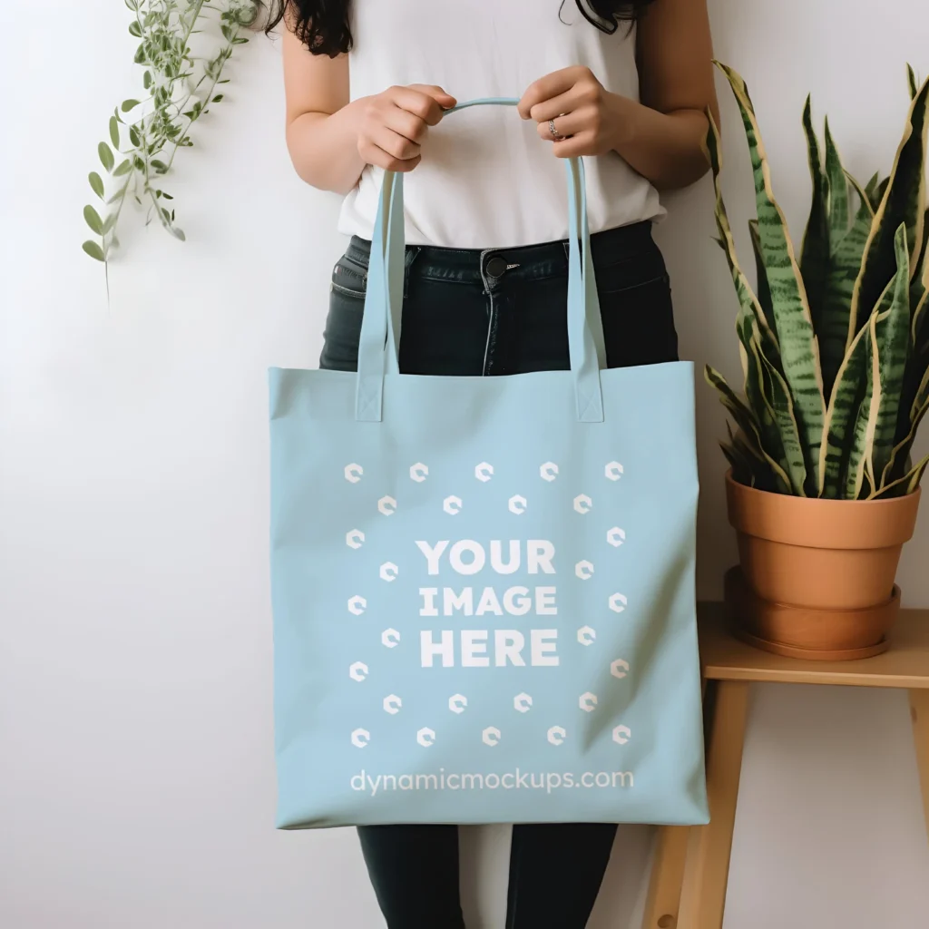 Woman Holding Light Blue Tote Bag Mockup Front View Template