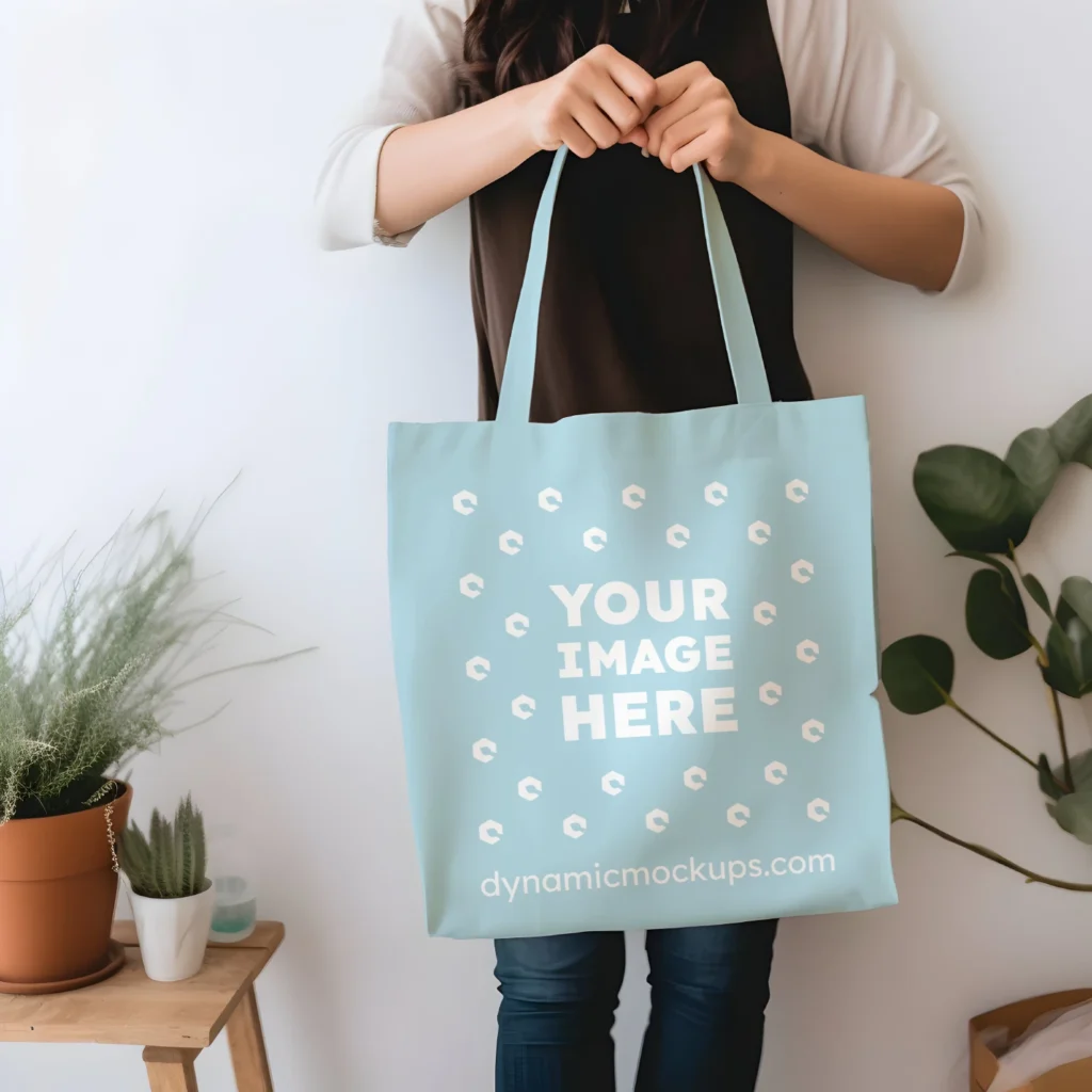 Woman Holding Light Blue Tote Bag Mockup Front View Template