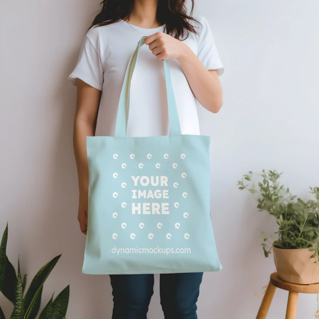 Woman Holding Light Blue Tote Bag Mockup Front View Template