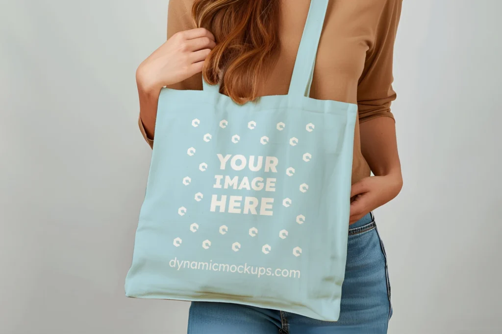 Woman Holding Light Blue Tote Bag Mockup Front View Template