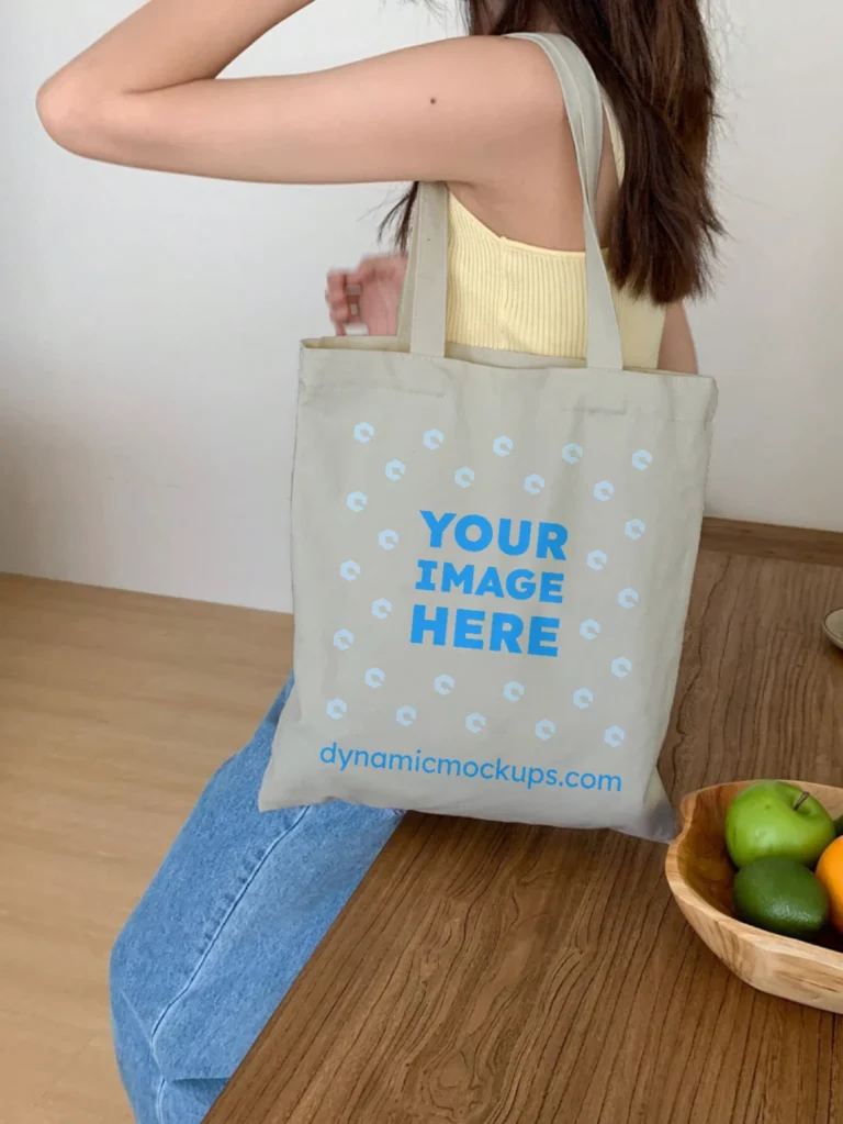 Woman Holding Light Gray Tote Bag Mockup Side View Template