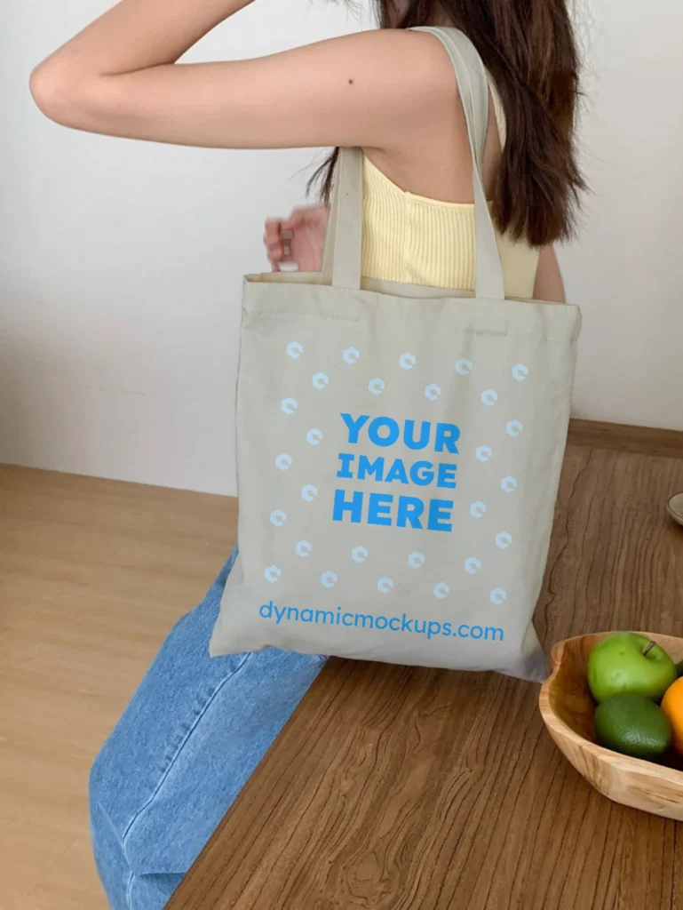 Woman Holding Light Gray Tote Bag Mockup Side View Template