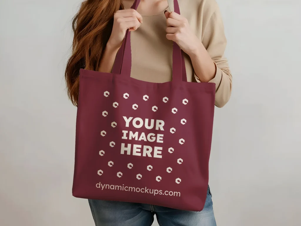 Woman Holding Maroon Tote Bag Mockup Front View Template