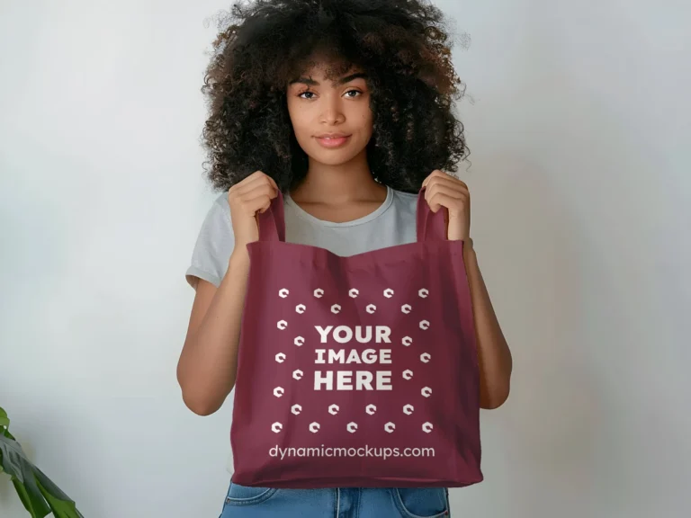 Woman Holding Maroon Tote Bag Mockup Front View Template