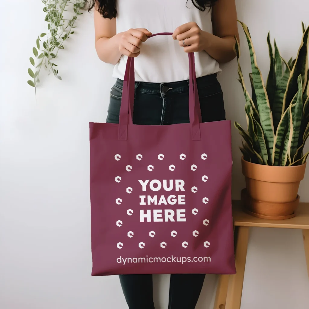 Woman Holding Maroon Tote Bag Mockup Front View Template