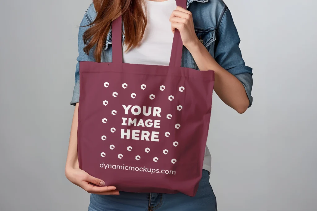 Woman Holding Maroon Tote Bag Mockup Front View Template