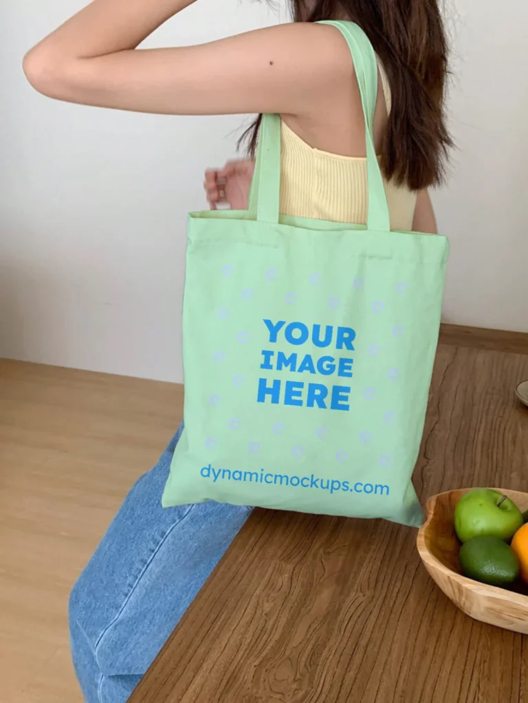 Woman Holding Mint Tote Bag Mockup Side View Template