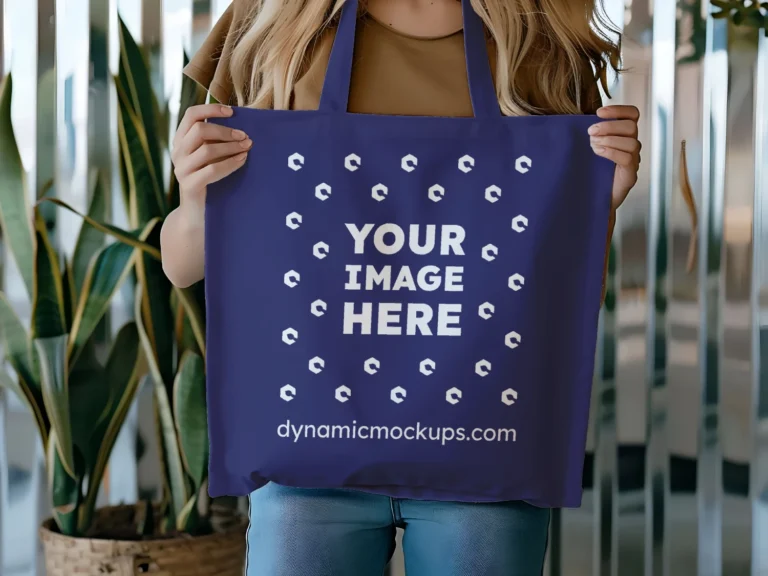 Woman Holding Navy Blue Tote Bag Mockup Front View Template