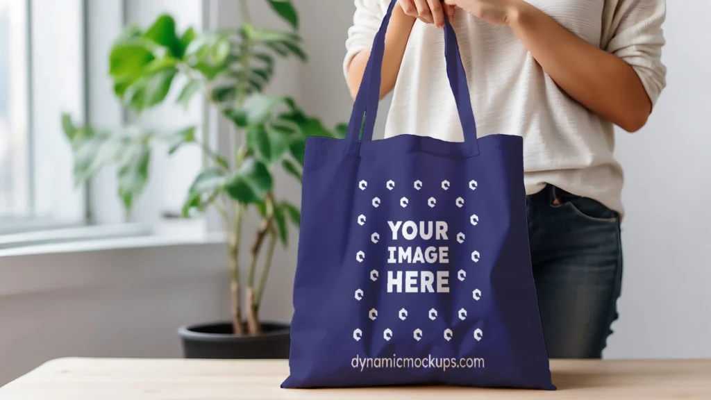 Woman Holding Navy Blue Tote Bag Mockup Front View Template