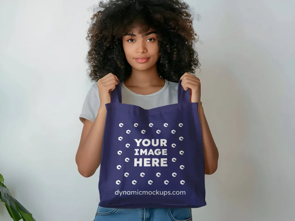 Woman Holding Navy Blue Tote Bag Mockup Front View Template